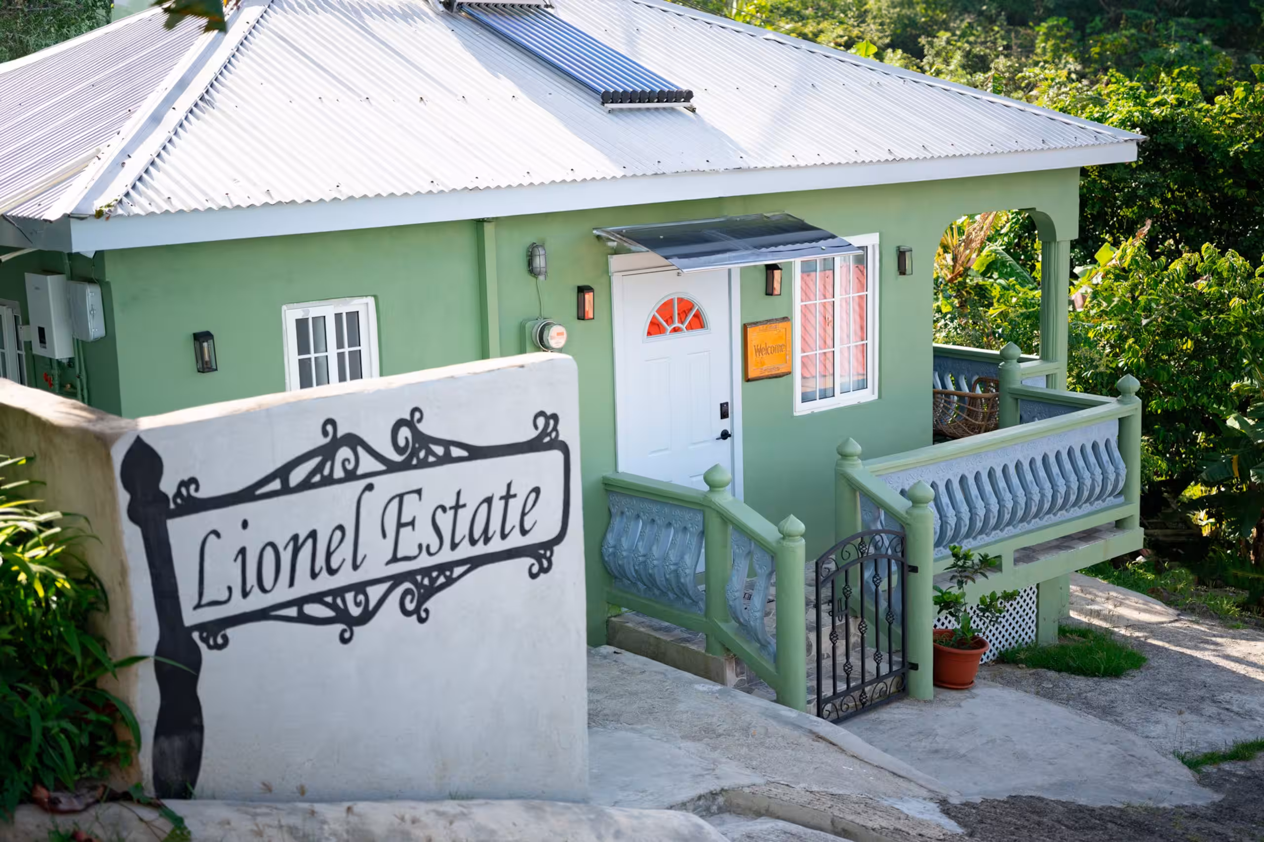 Front entrance and balcony of Lionel Estate surrounded by greenery